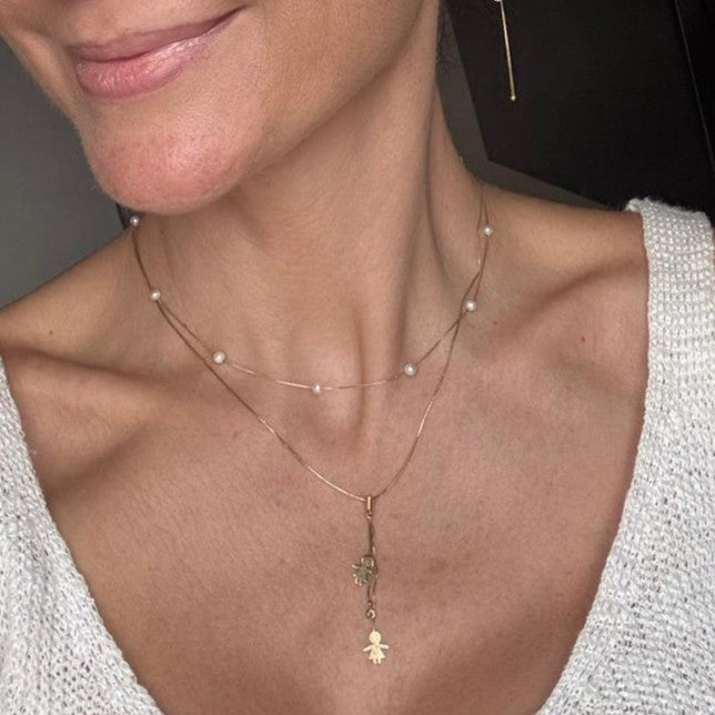 colar perolas naturais ouro 18k em uso