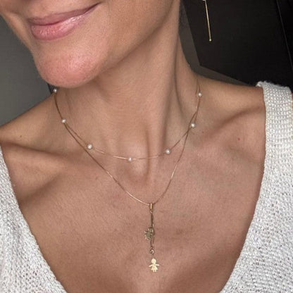 colar perolas naturais ouro 18k em uso