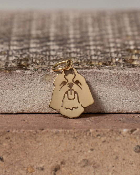 Pingente Shih Tzu ouro 18k apoiado na pedra